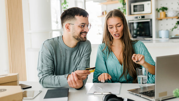 young couple shopping online at home
