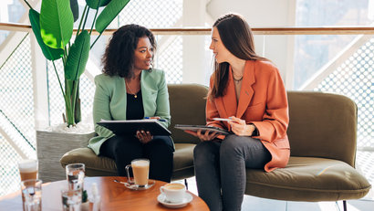 two women chatting in the office