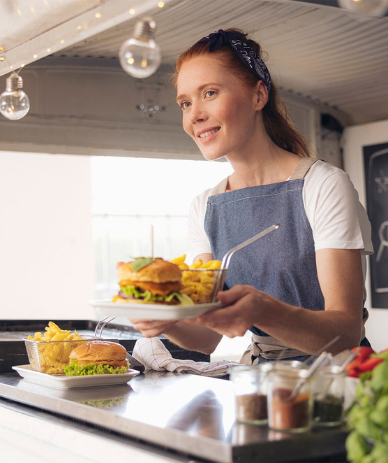 Lady working in a food truck