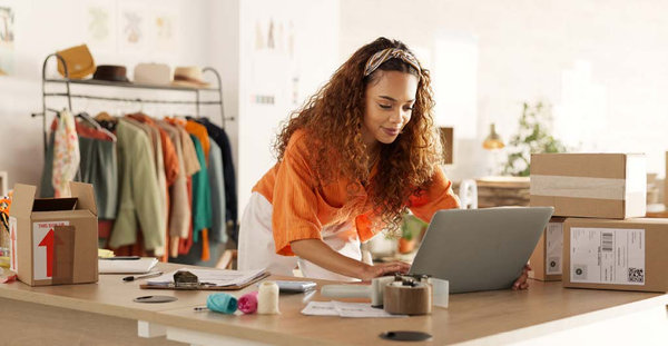 A woman working on her laptop.