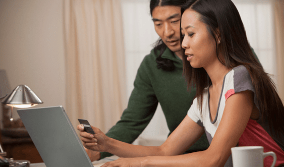 a couple using a laptop