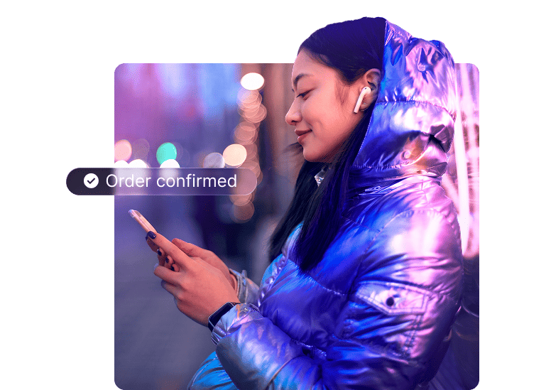 User checking an order confirmation on their smartphone, representing seamless AI-driven agentic commerce.