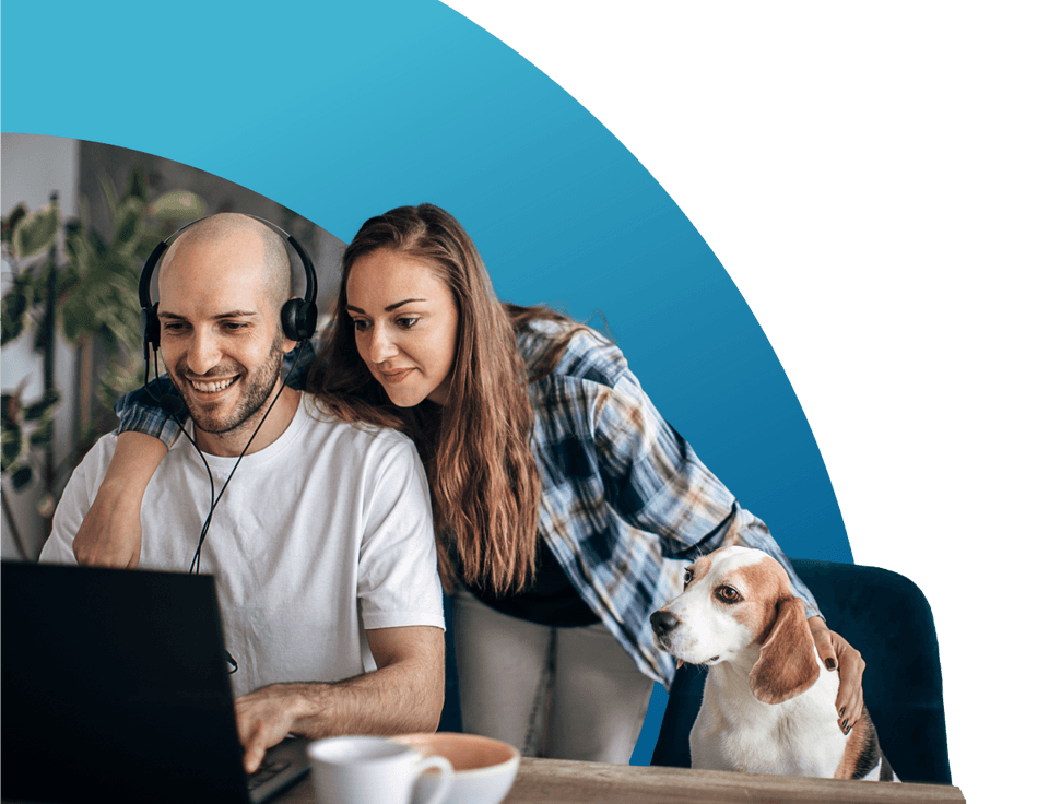 Couple with their dog online computer