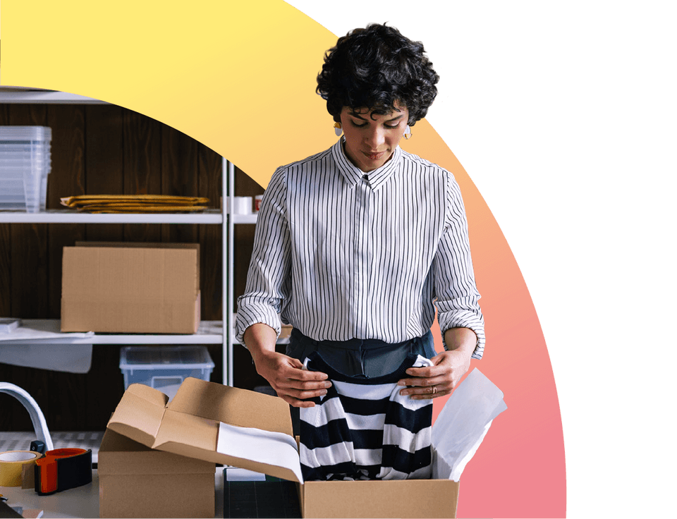 Businesswoman preparing packages for shipping in her store