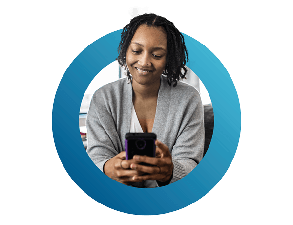 woman holding smartphone on sofa at home mobile banking