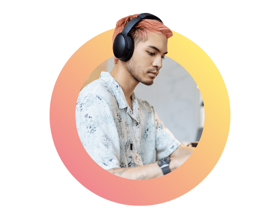 img-cut-ring-full-rhubarb-corn-asian-man-wearing-headphones-working-on-laptop-at-startup-office