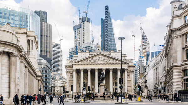 Street in City of London with Royal Exchange Bank of England and new modern skyscrapers