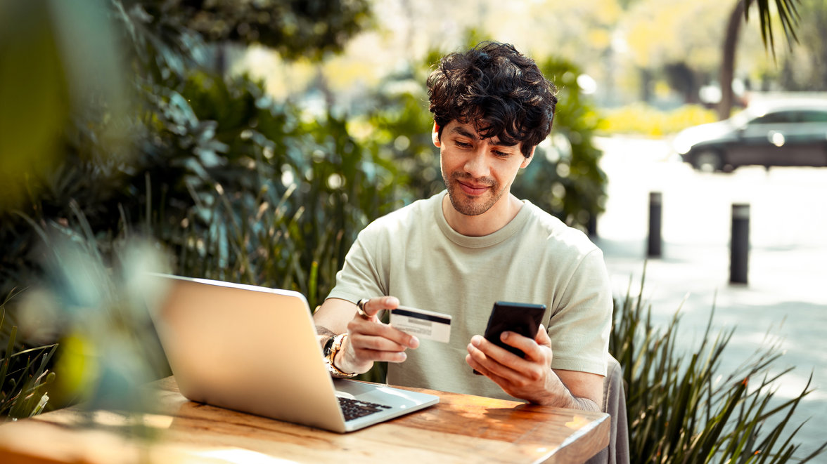 man-sitting-and-paying-online-with-credit-card