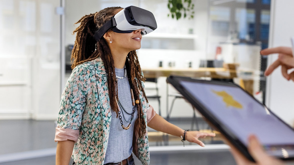 Woman testing VR glasses in an office