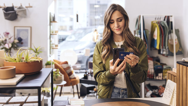 customer uses tap on mobile to make a purchase in a store