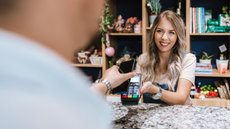 woman receiving payment on terminal