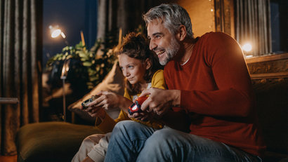 daughter and father playing video games