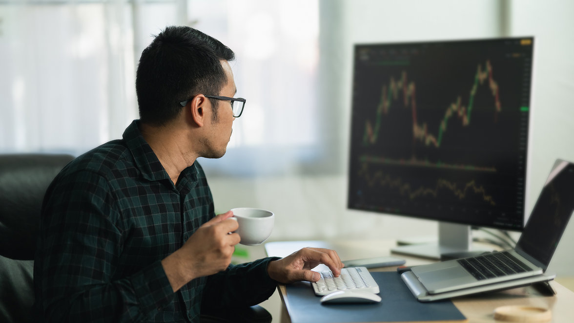 A man checking risk dashboard on his computer