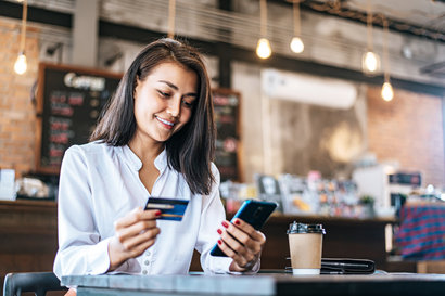 Woman with her phone and credit card