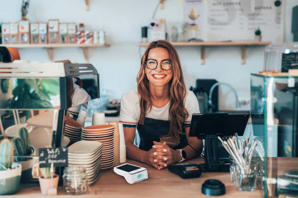 Woman smilling in front of cashier