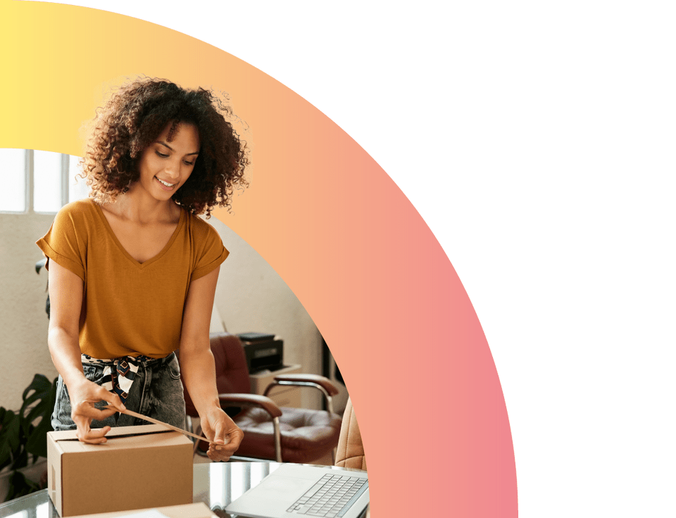 female entrepreneur packing box at home