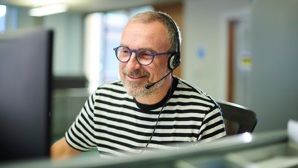 man in the office wearing headset