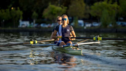 two female athletes rowing
