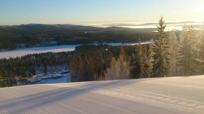 landscape photo of a snowy hill in Finland