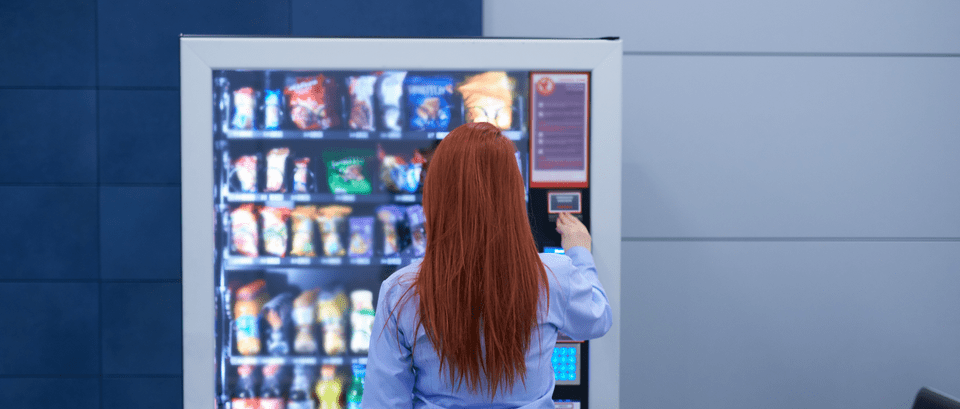woman front of a vending machine