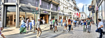 a shopping street packed with people