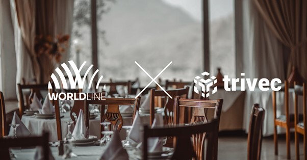 uppdukade bord på tom restaurang med Worldline logga och Trivec logga